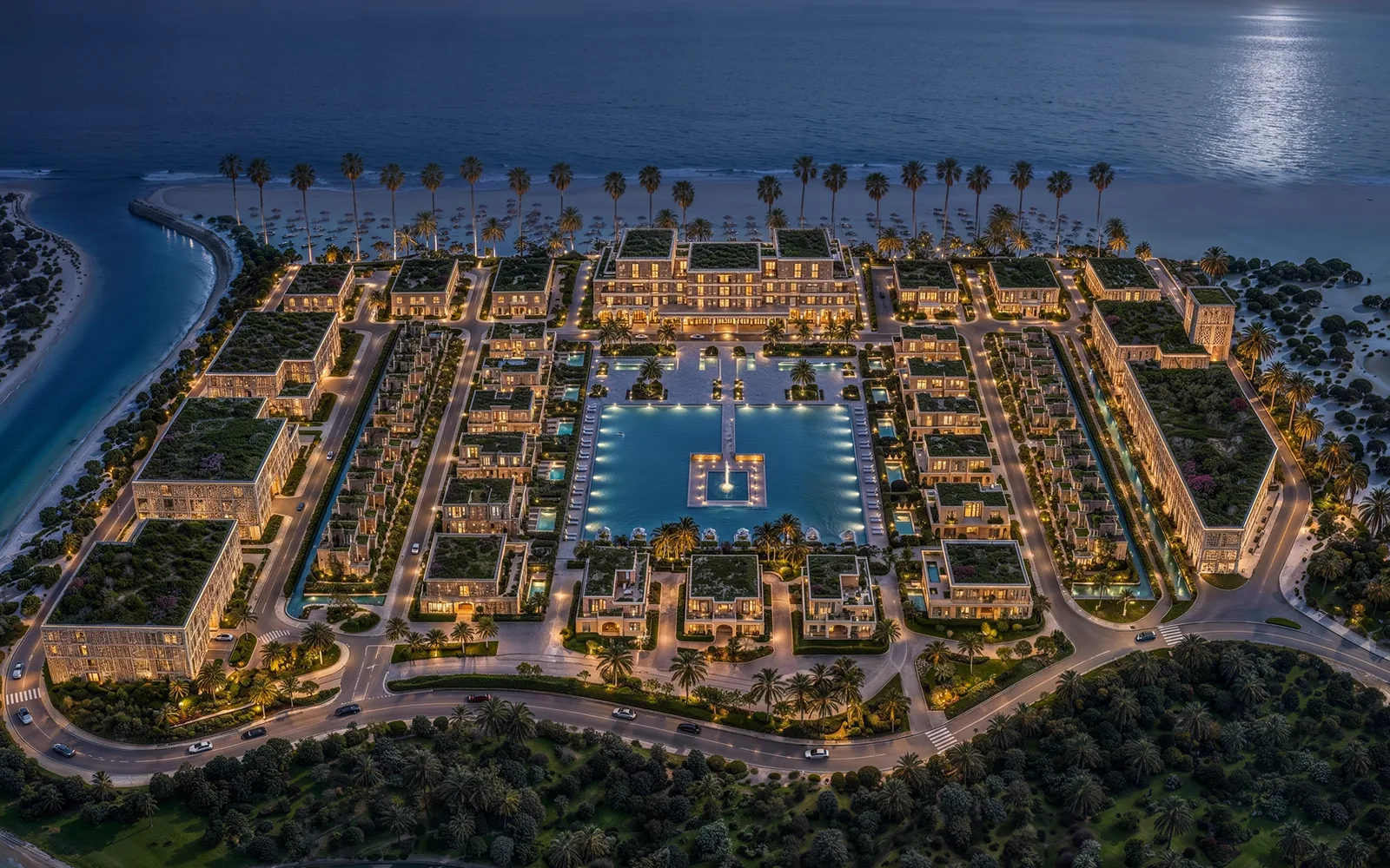 Mira Ocean Estates lit at dusk beside the Arabian Sea